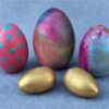 Egg Decorating Kit. A grouping of five wooden eggs, decorated in various colors