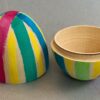 Egg Decorating Kit. Hollow wooden egg in two pieces, painted with watercolor stripes.