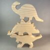 Watercolor Dinosaurs Kit. Three plain dinosaurs, stacked one on top of the other: A T-Rex, Stegasaurus, and Brontosaurus.