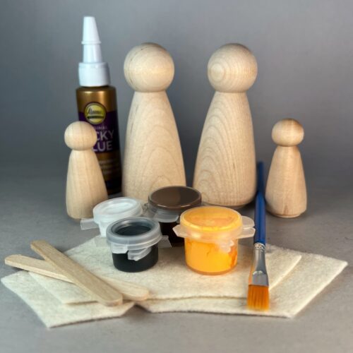Wooden Peg Animals kit Contents of the peg animals kit including unpainted peg dolls in two sizes, paint, paint brush, glue and felt.