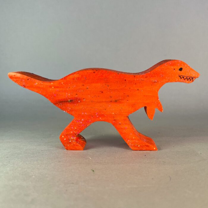 Watercolor Dinosaurs Kit. Wooden cutout of a T-Rex, painted orange.