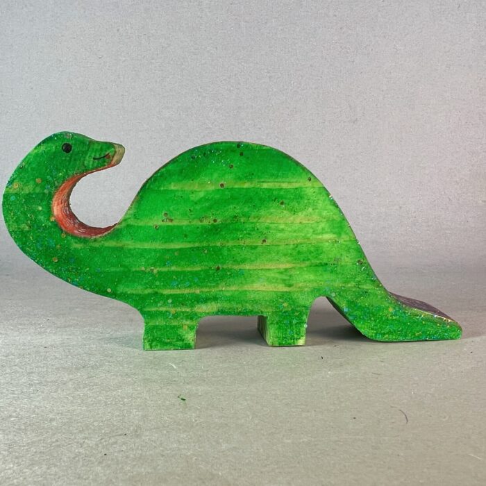 Watercolor Dinosaurs Kit. A green wooden brontosaurus looking over his shoulder.