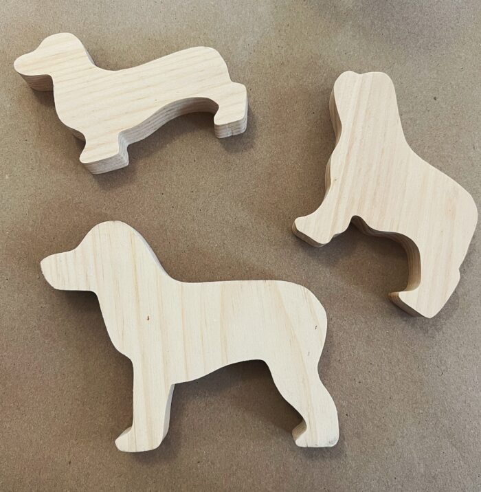 Painted Dogs Kit. Three un finished wooden dog cutouts: a Dachshund, French Bulldog, Labrador Retriever.