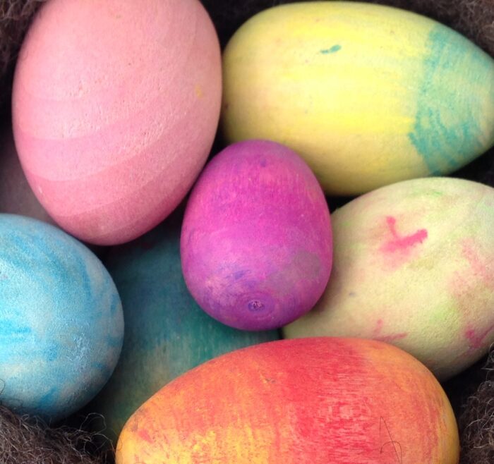 Egg Decorating Kit. Seven wooden eggs, decorated in pastel colors.